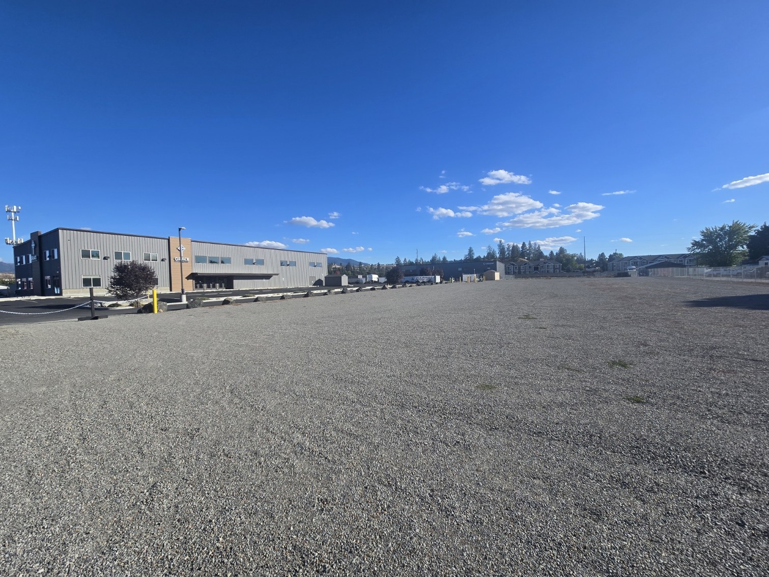 Wide view of Appleway Business Park showing front and rear buildings and additional gravel land